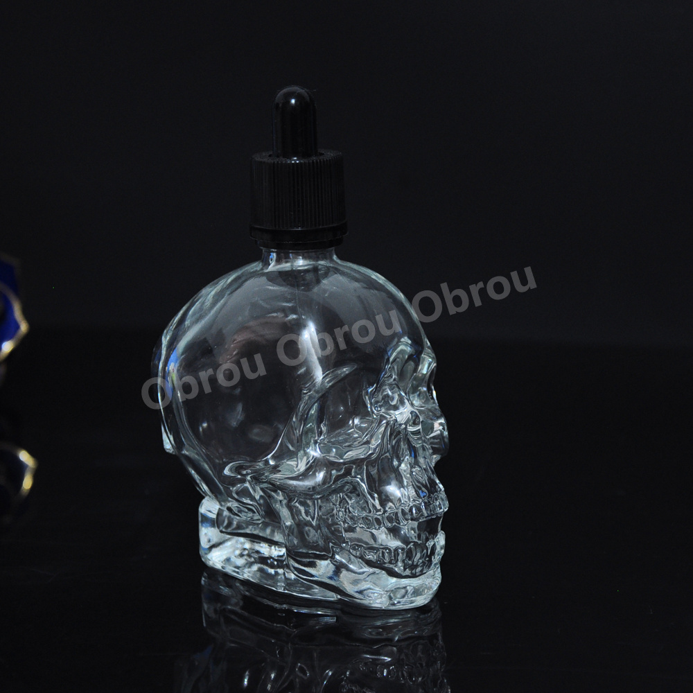 Wholesale 30ml perfume bottle essential oil glass skull bottle with child proof dropper