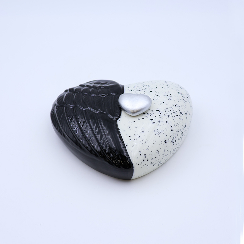 Custom ceramic black and white heart shaped wings pet human cremation urns wholesale handmade keepsake funeral urn