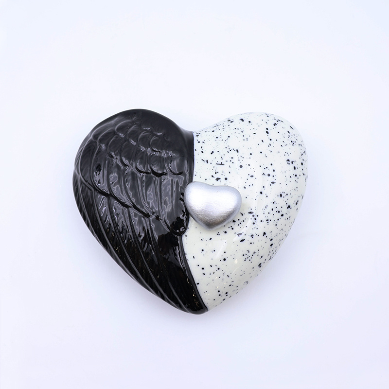 Custom ceramic black and white heart shaped wings pet human cremation urns wholesale handmade keepsake funeral urn