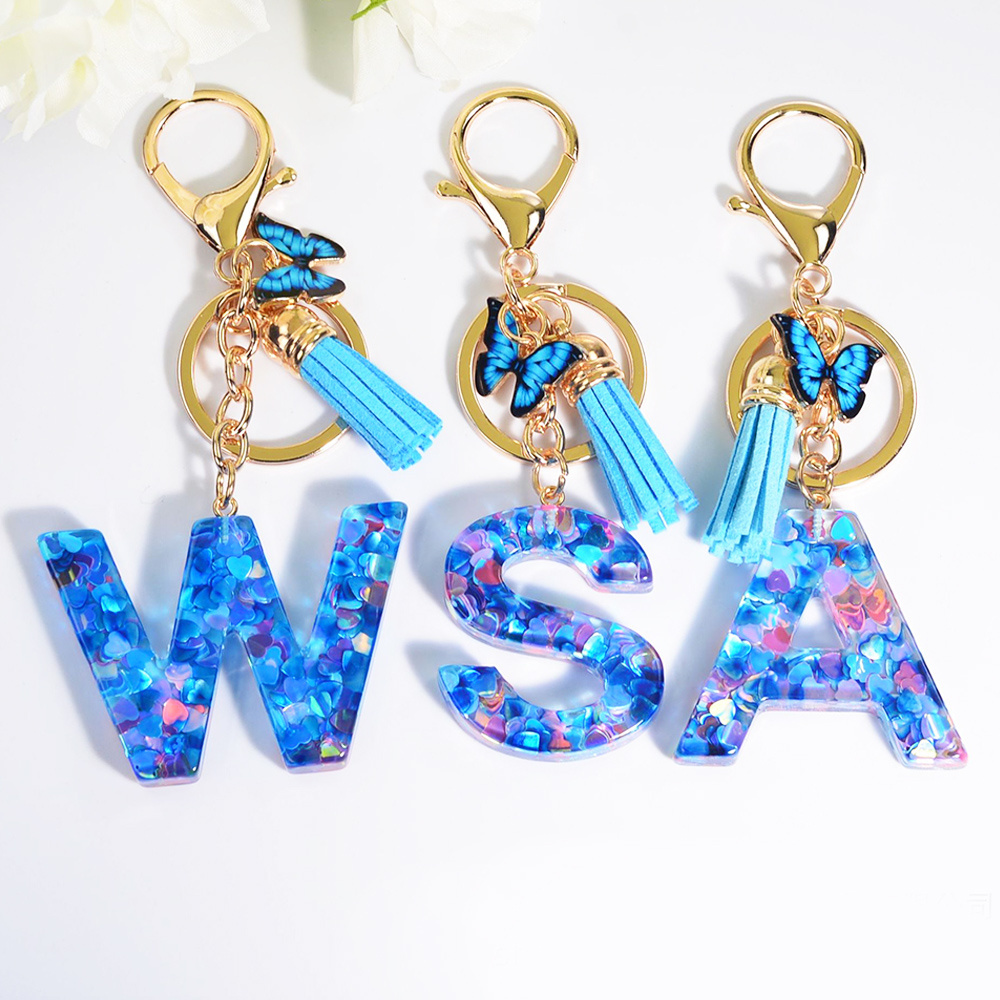 Wholesale blue butterfly fashion mini cute metal tassels resin key chain custom letter initial acrylic plastic keychain