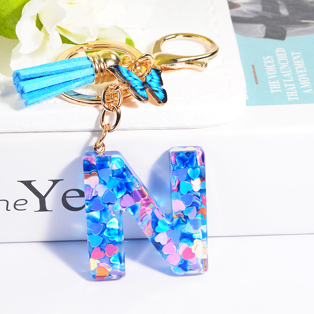 Wholesale blue butterfly fashion mini cute metal tassels resin key chain custom letter initial acrylic plastic keychain