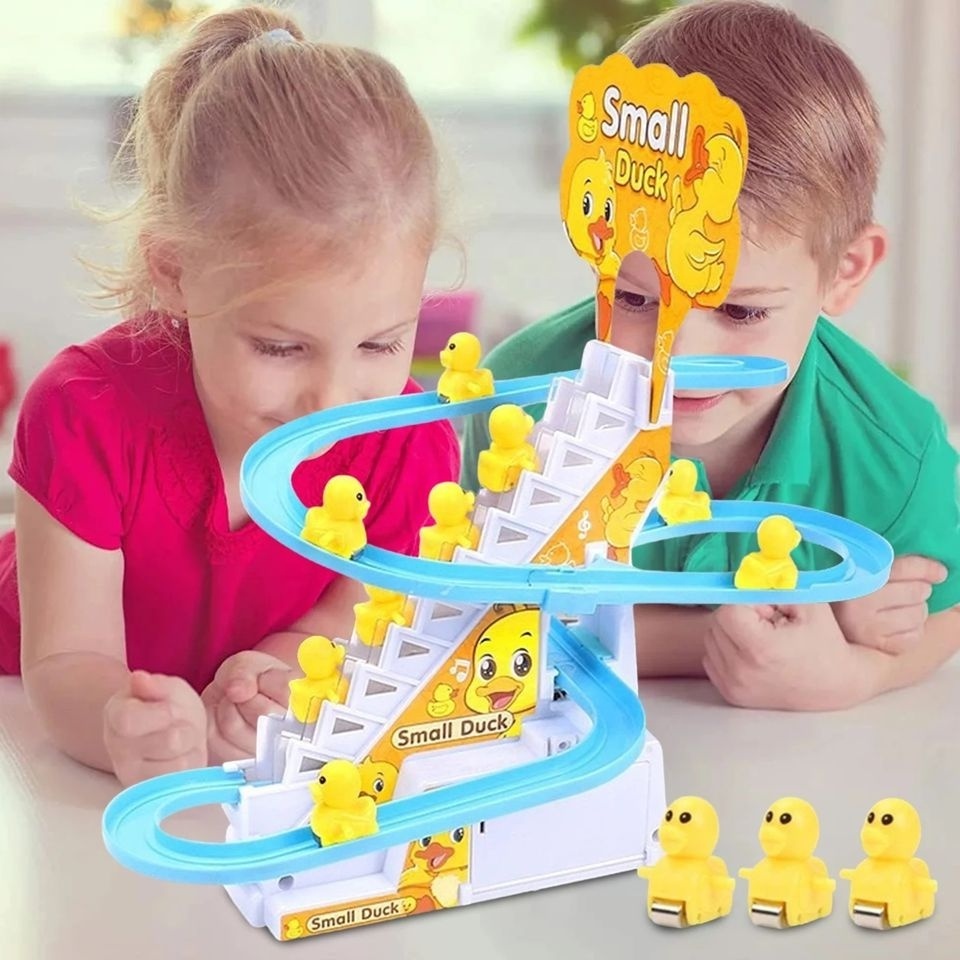 Shantou New arrival Funny yellow duck climbing stairs light music DIY track electric assembling plastic game toy for kids