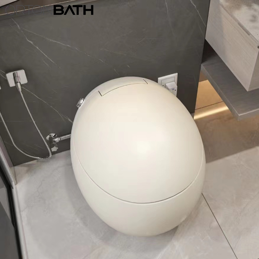 ORTONBATH Oval Round Ceramic Egg Shape One Piece Ceramic Toilette Bowl One Piece Toilet Glossy White Smart Automatic Intelligent