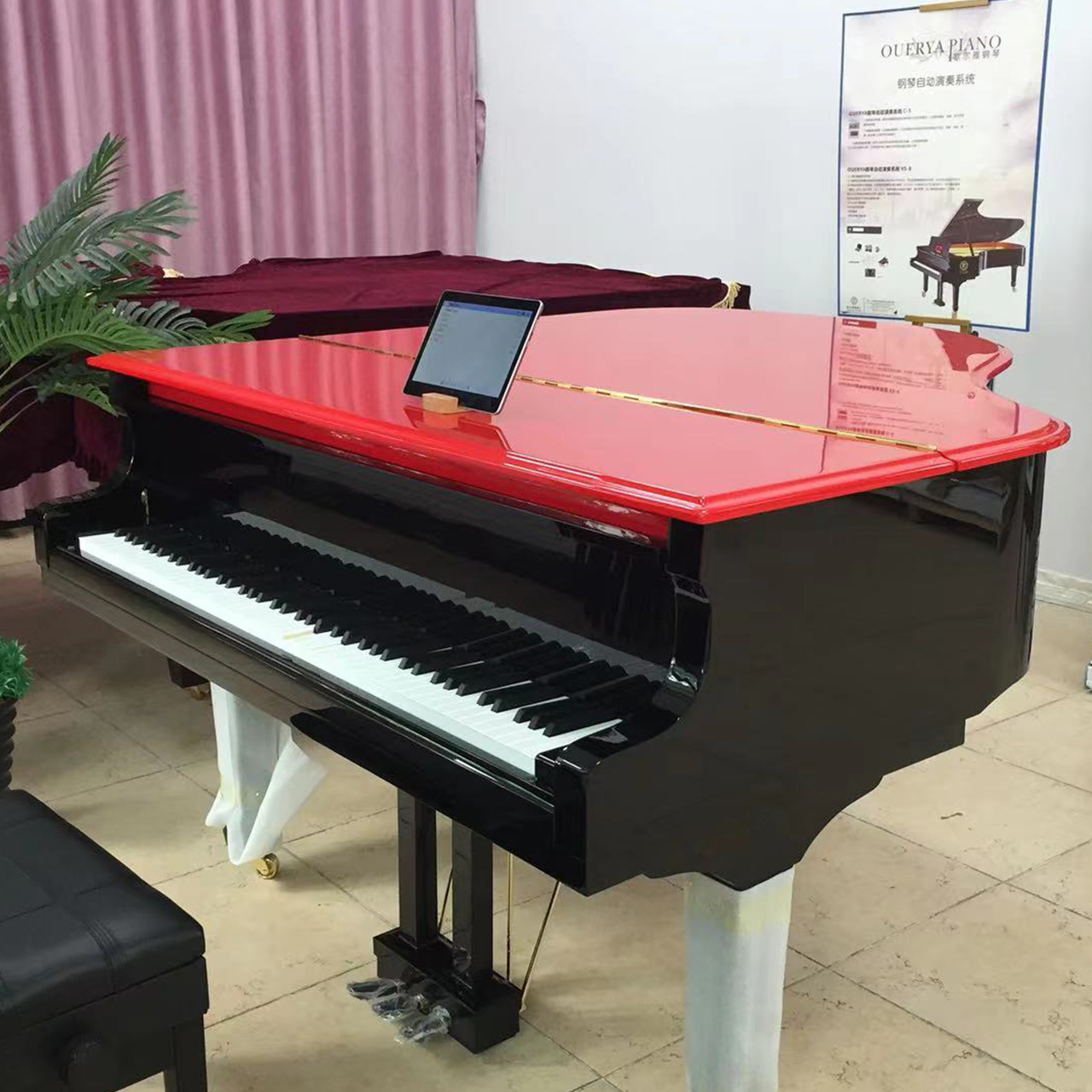 Grand piano with red top  The hotel plays the piano automatically  Six foot grand piano