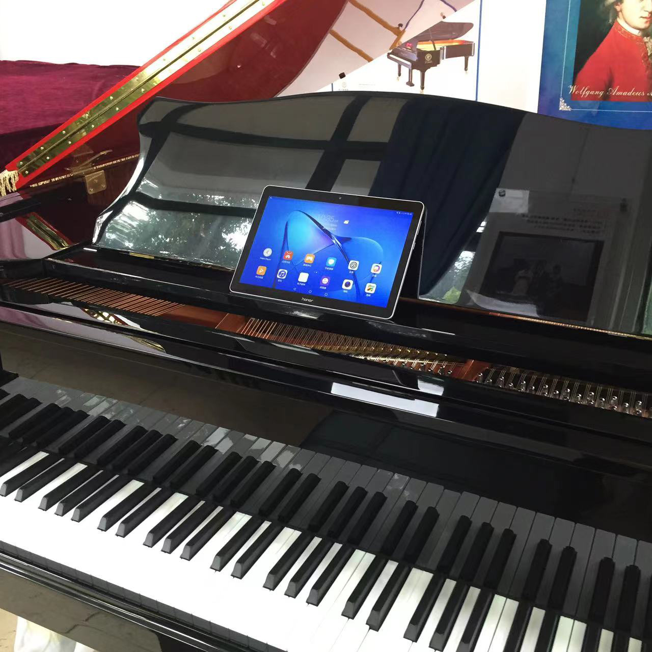 Grand piano with red top  The hotel plays the piano automatically  Six foot grand piano