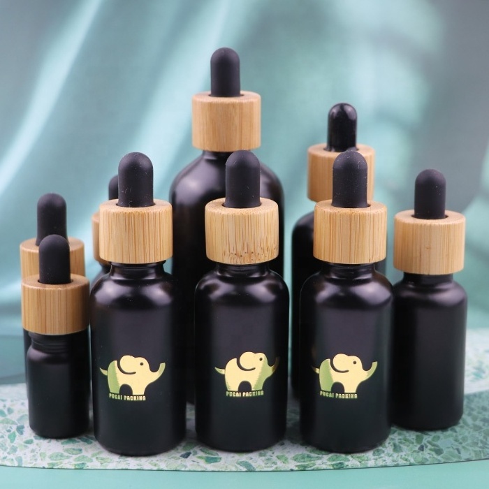 empty 30 ml 1 oz cosmetic cuticle hair essential oil bottles 30ml frosted black glass dropper bottle with bamboo lid top