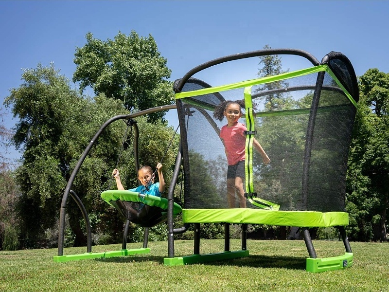 Kids jumping 4' trampoline and Saucer Swing Set  toys in Green/Black