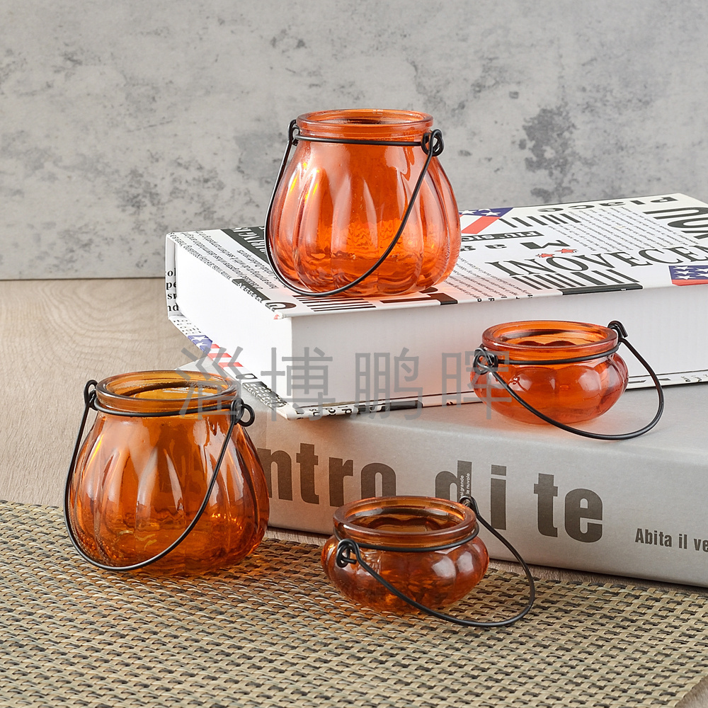 Wholesales cheap price pumpkin shape  spraying color empty glass candle jar with metal handle for halloween