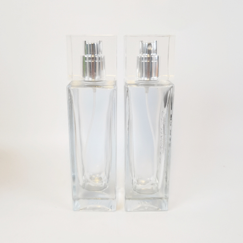 Transparent 50ml perfume bottles wholesale rectangular attar crystal bottle pump spray attar glass oil bottle