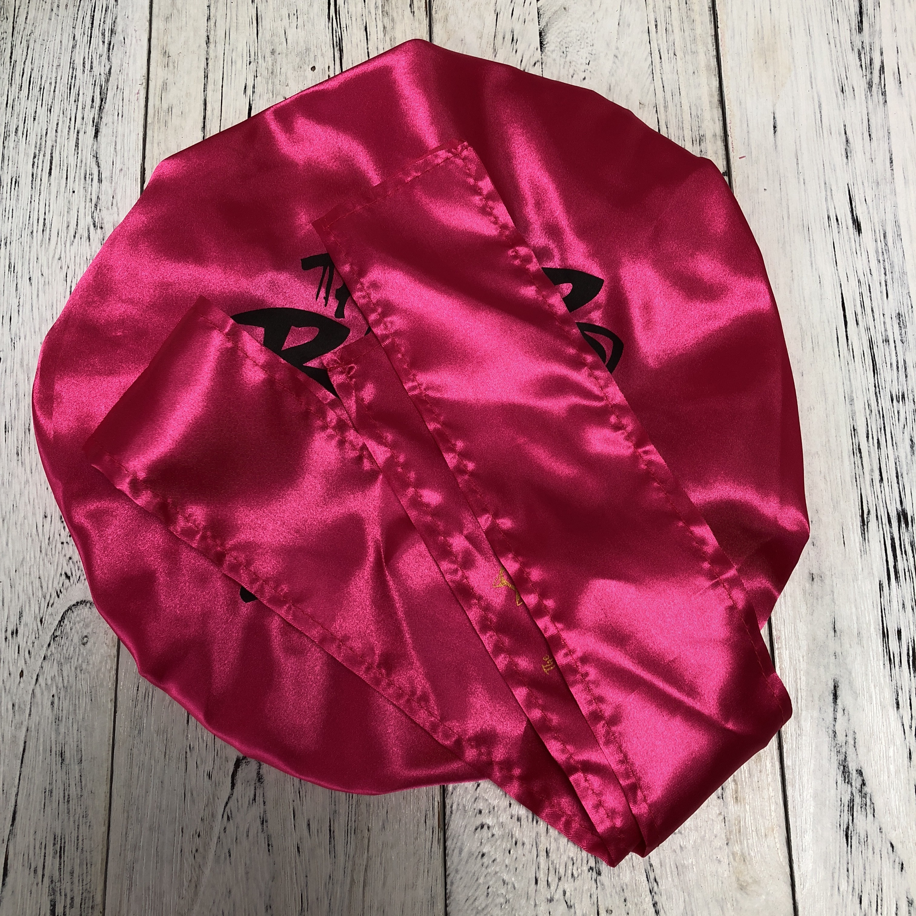 adjustable bonnet with designers  logo for hair