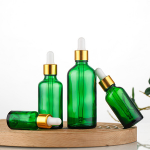 luxury refillable 5ml 10ml 15ml 30ml 50ml 100ml dark green glass dropper bottles for essential oil wholesale