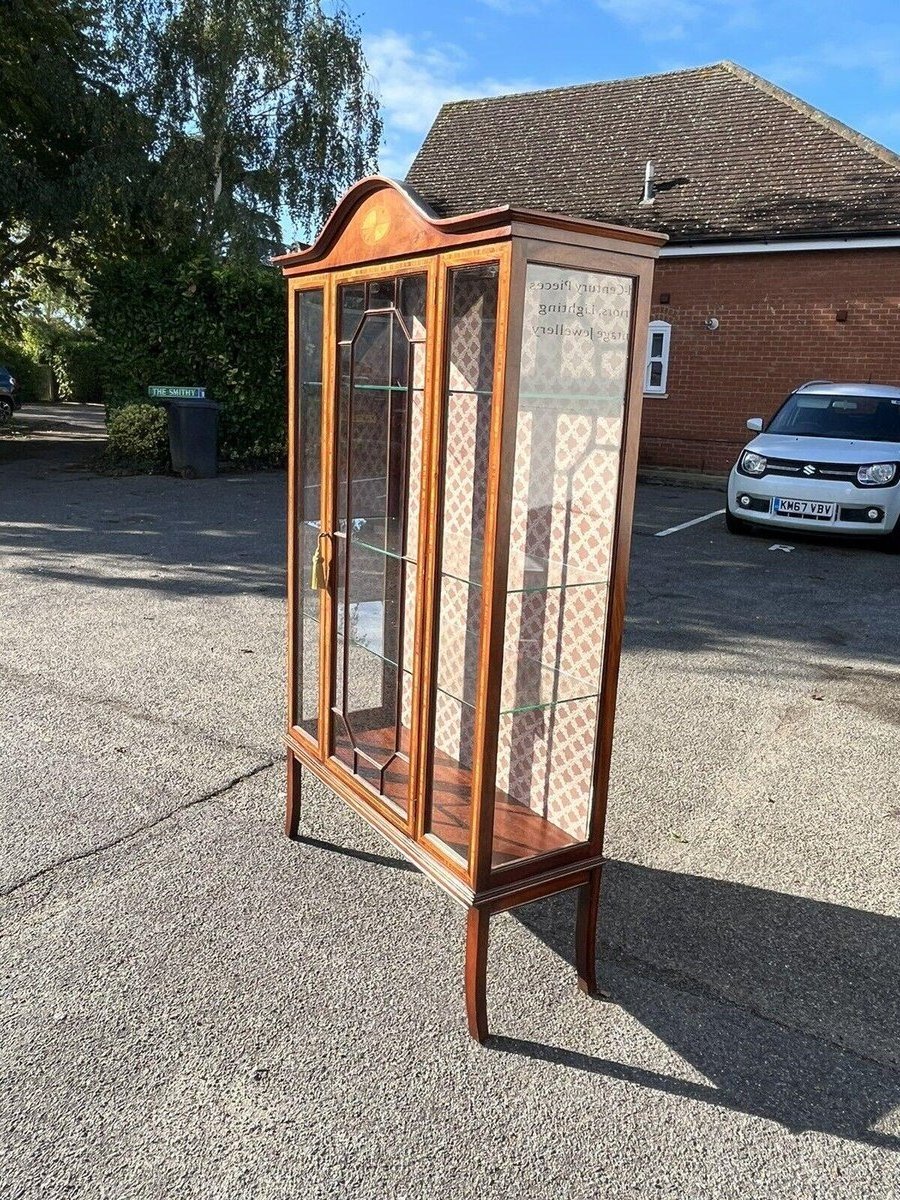 James large display cabinet in mahogany and glass with a glossy brown finish.