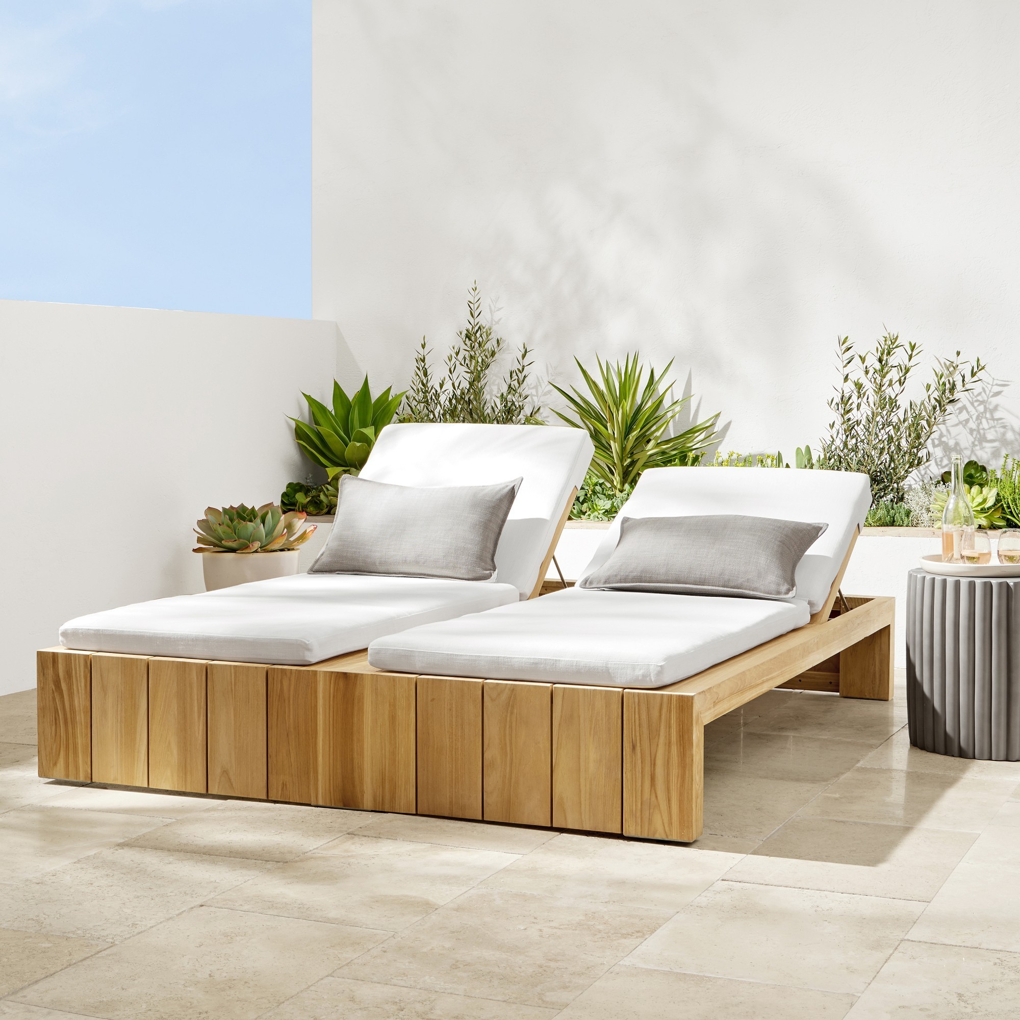 Zilak sun lounger pairs from solid jai wood and soft cushions with a natural finish.