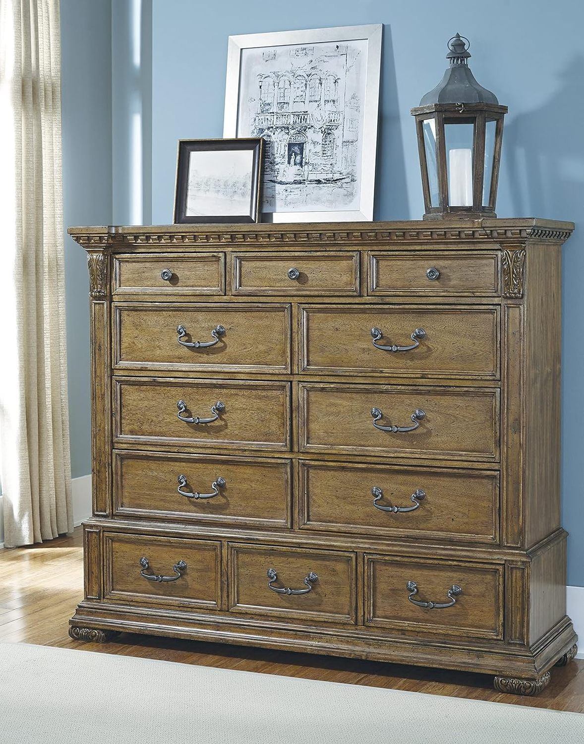 Jennie dresser made of solid mahogany wood with wood carvings and a natural brown finish.