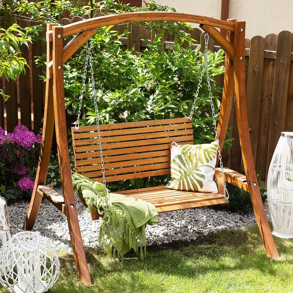 Heidy garden swing made of high quality solid teak wood with 2 seats with a shiny walnut finish.