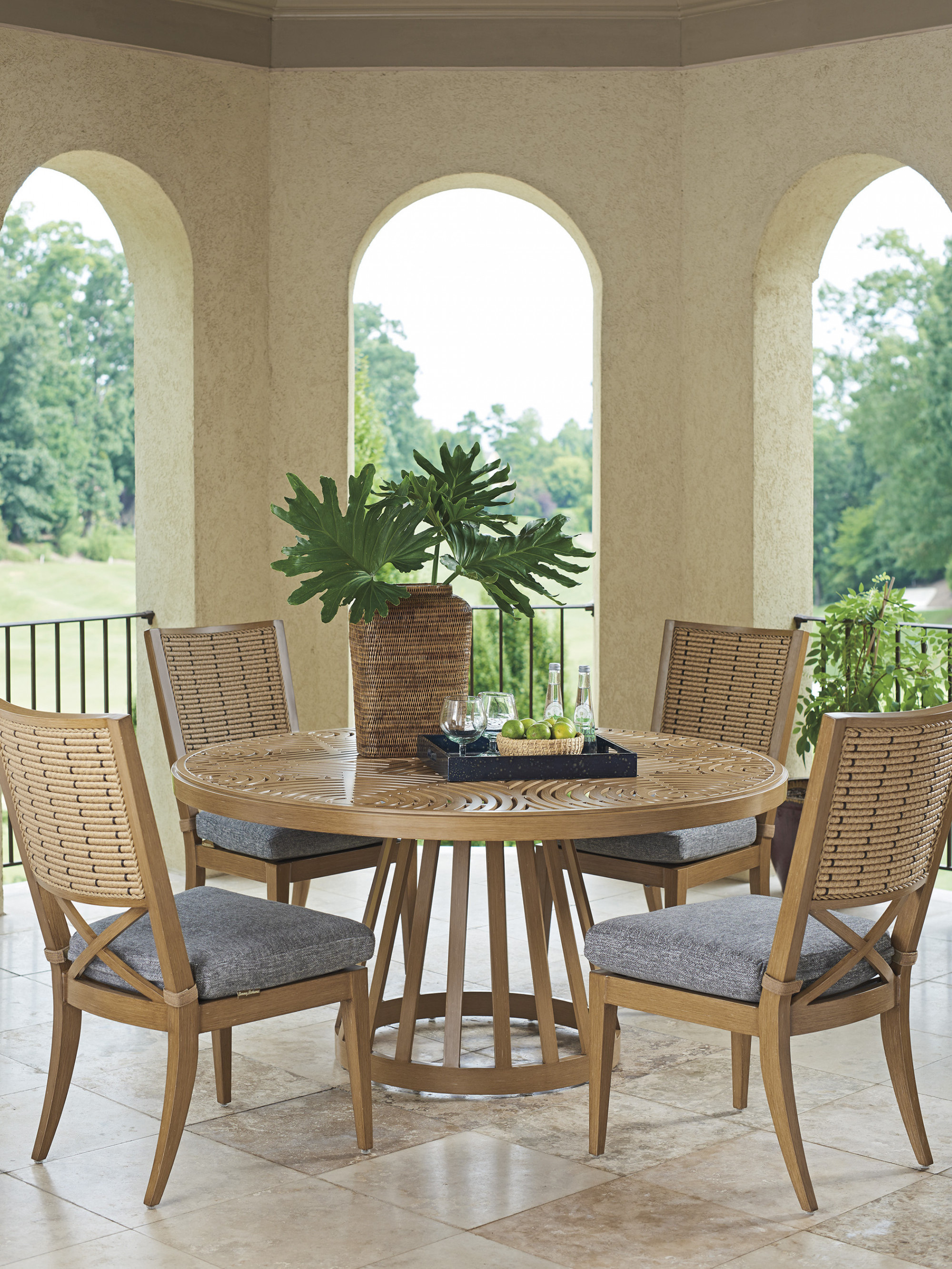 Jimmy solid wood round dining table with golden brown finish for outdoor and indoor.