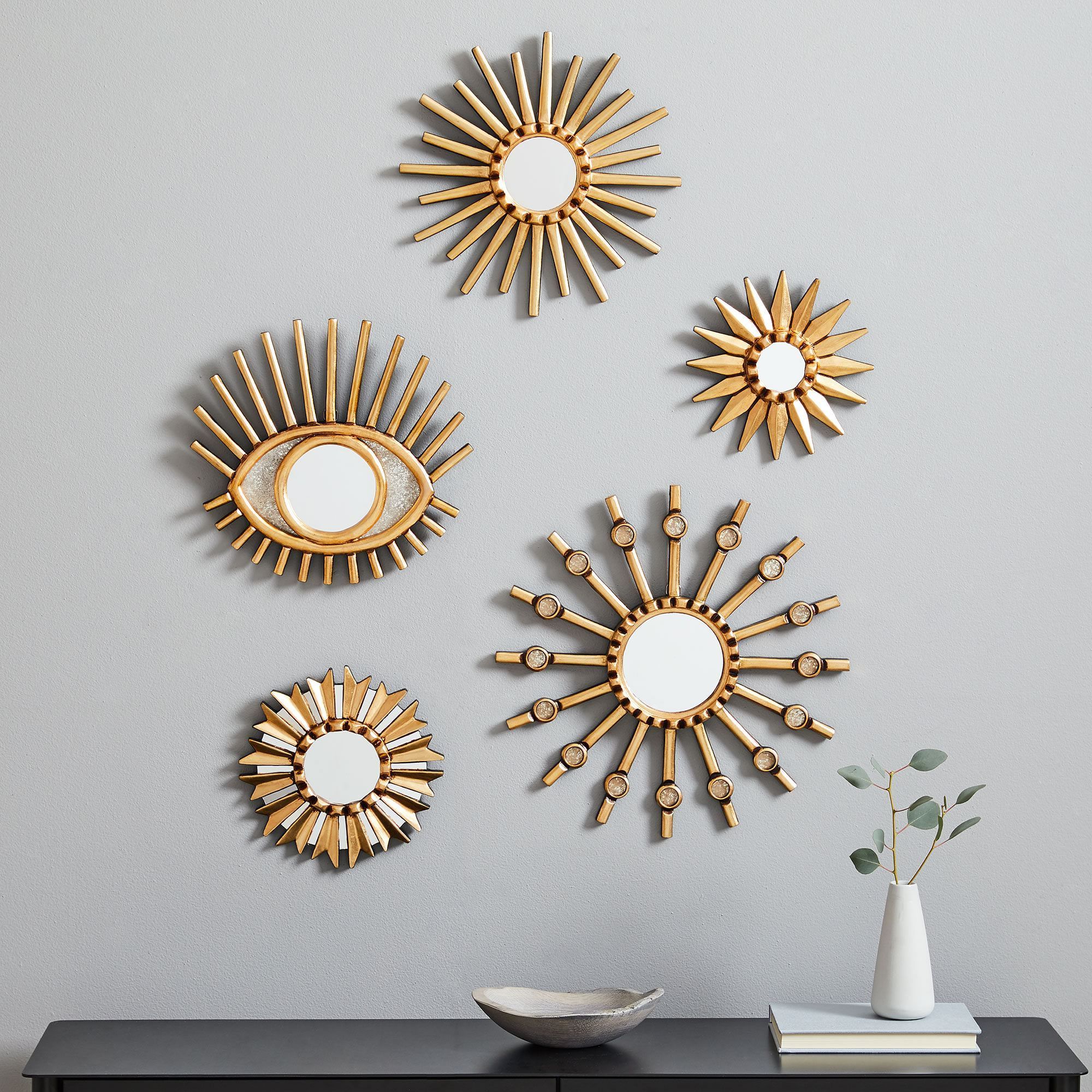 Jisung starburst wall decorative mirror made of solid teak wood suitable for living room or bedroom decoration.