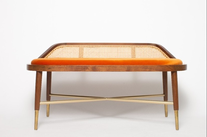 Frank modern indoor bench made of solid teak wood with a woven rattan back and soft velvet seat.