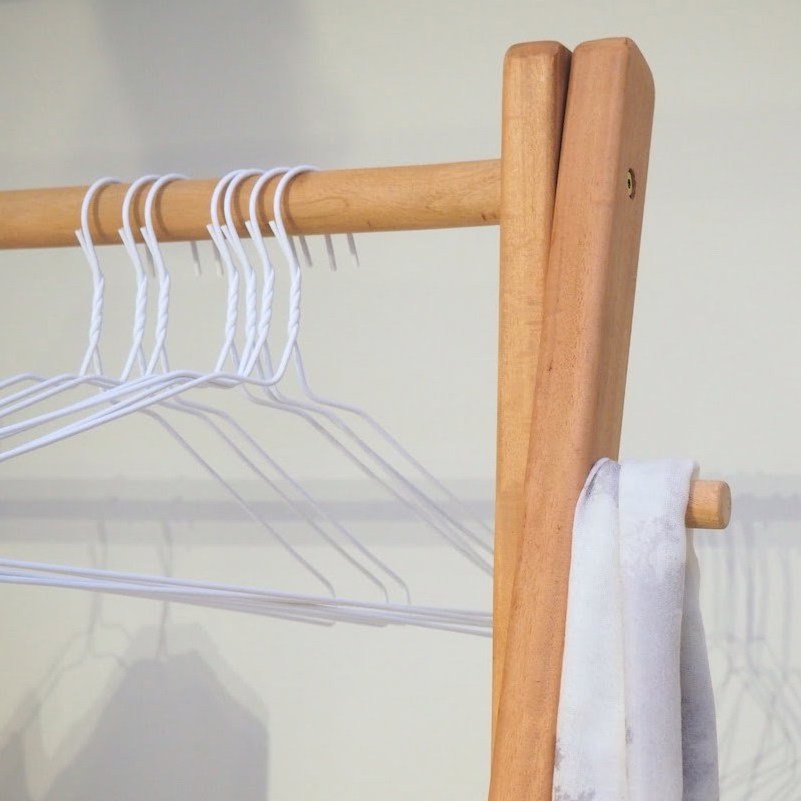 Alcott Hanging clothes rack, removable storage drawer that slides in and out w/ natural finish