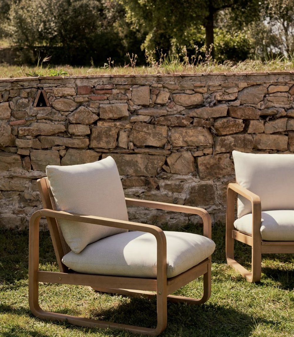 Donatello outdoor armchair made from solid teak wood frame and thick, waterproof cushion with a natural finish.