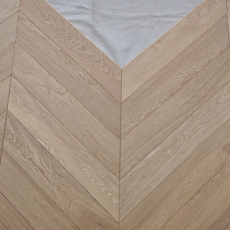 Wire brushed light natural color herringbone chevron fishbone wood flooring