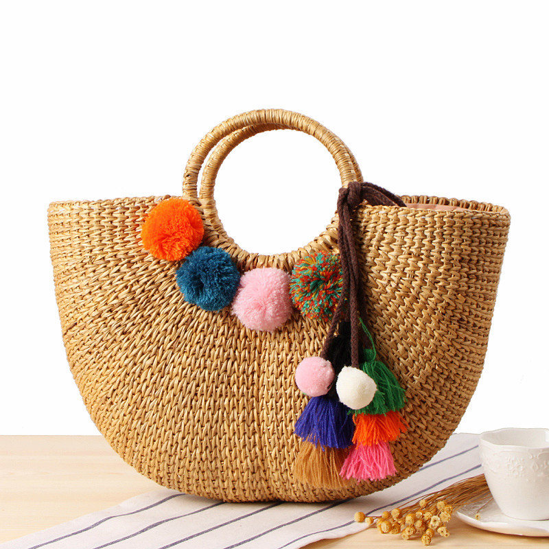 Fashionable Handmade Yellow Grass Woven Handbags Rattan Summer Beach Bag Drawstring Straw Bag With Colorful Tassel Wool Ball