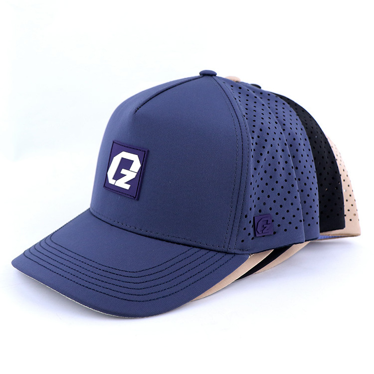 Qianzun rubber patch waterproof lightweight polyester performance perforated 5 panel laser cut baseball cap custom golf hat