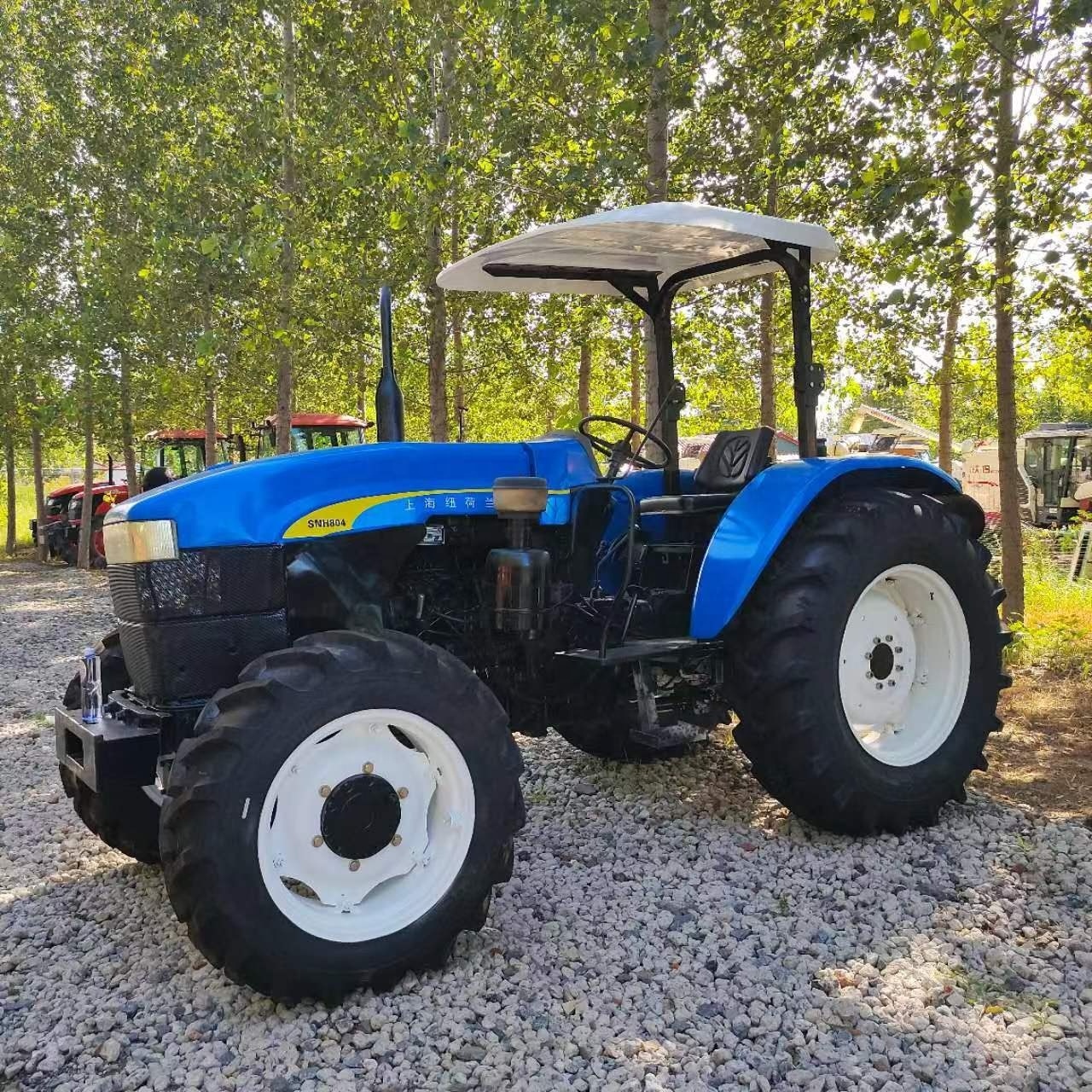 Used Agricultural Machinery Farm Wheel Small Mini Compact Tractors New Holland Snh754 With dry tires and farm tools