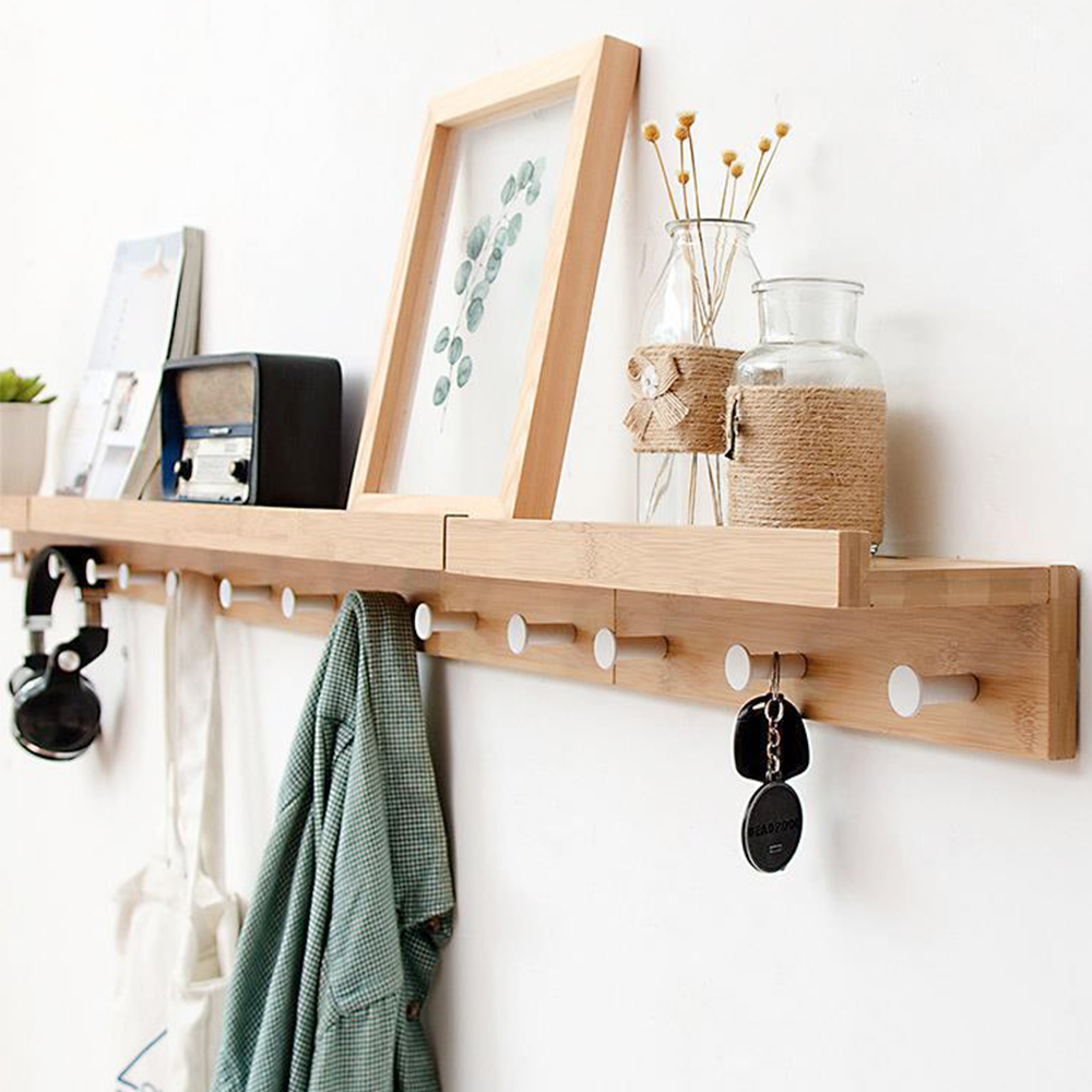 Minimalist bamboo wall shelf with storage hooks used for living room bedroom