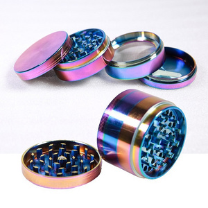 The new tobacco grinder 63MM4-layer zinc metal ice blue grinder is dazzling in color