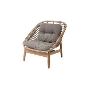 munsy lounge chairs made of rattan frame and solid teak wood leg frames with cushions for indoor and outdoor