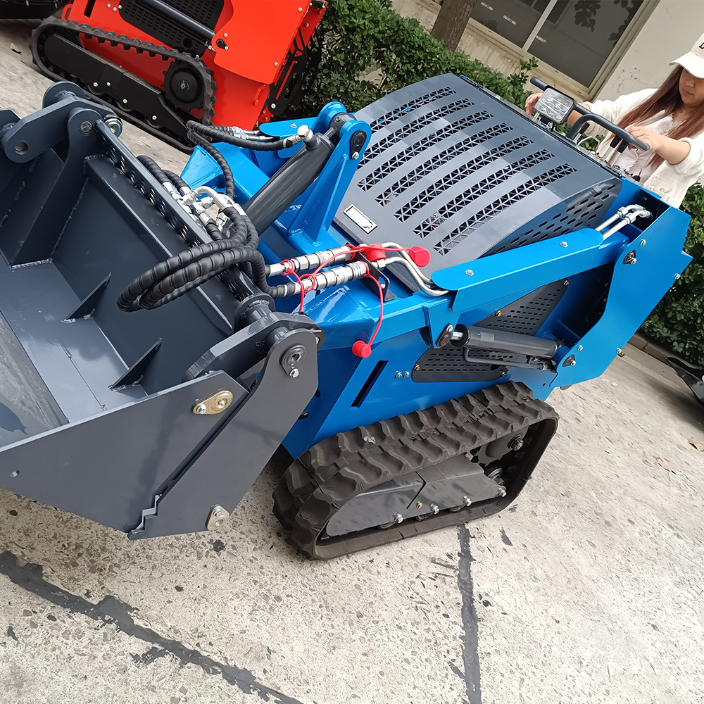 Small crawler electric skid steer loader with wood grabber