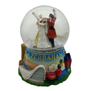 Custom Azerbaijan Dancing Couple statue resin craft glass snow globe for promotional souvenir gifts