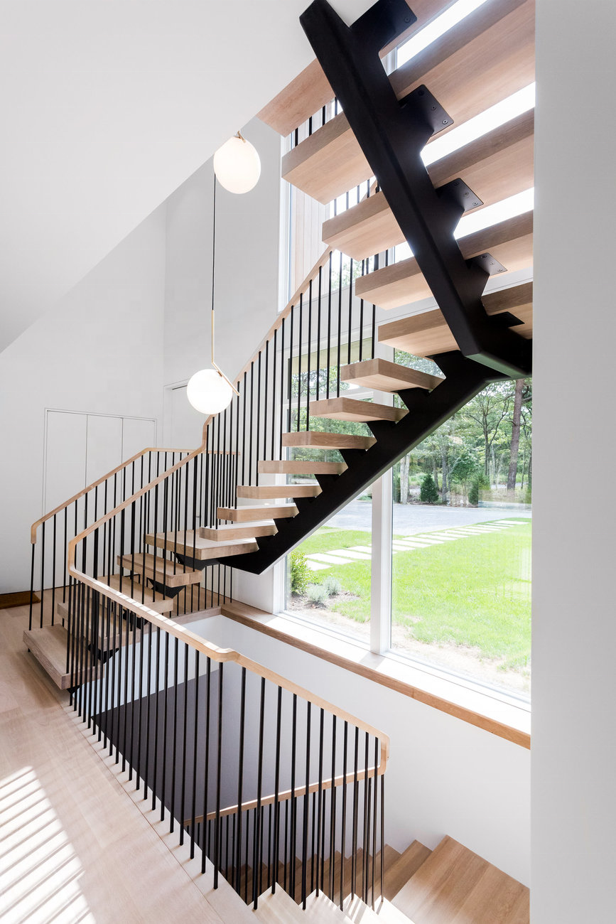 Modern Mono-Stringer Steel Spindle Railing On Floating Stairs With White Oak Treads And Top Rail Stairs