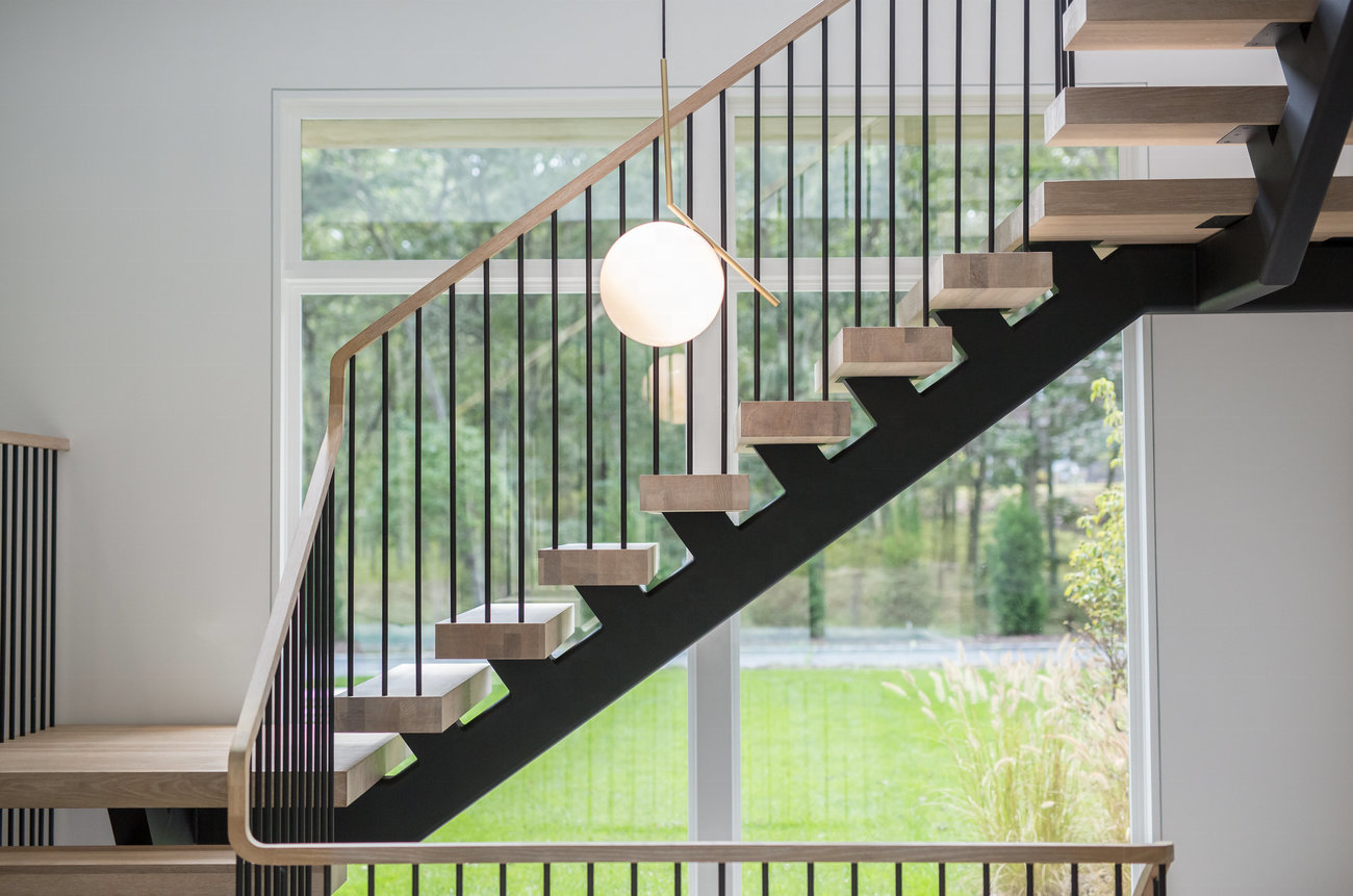 Modern Mono-Stringer Steel Spindle Railing On Floating Stairs With White Oak Treads And Top Rail Stairs