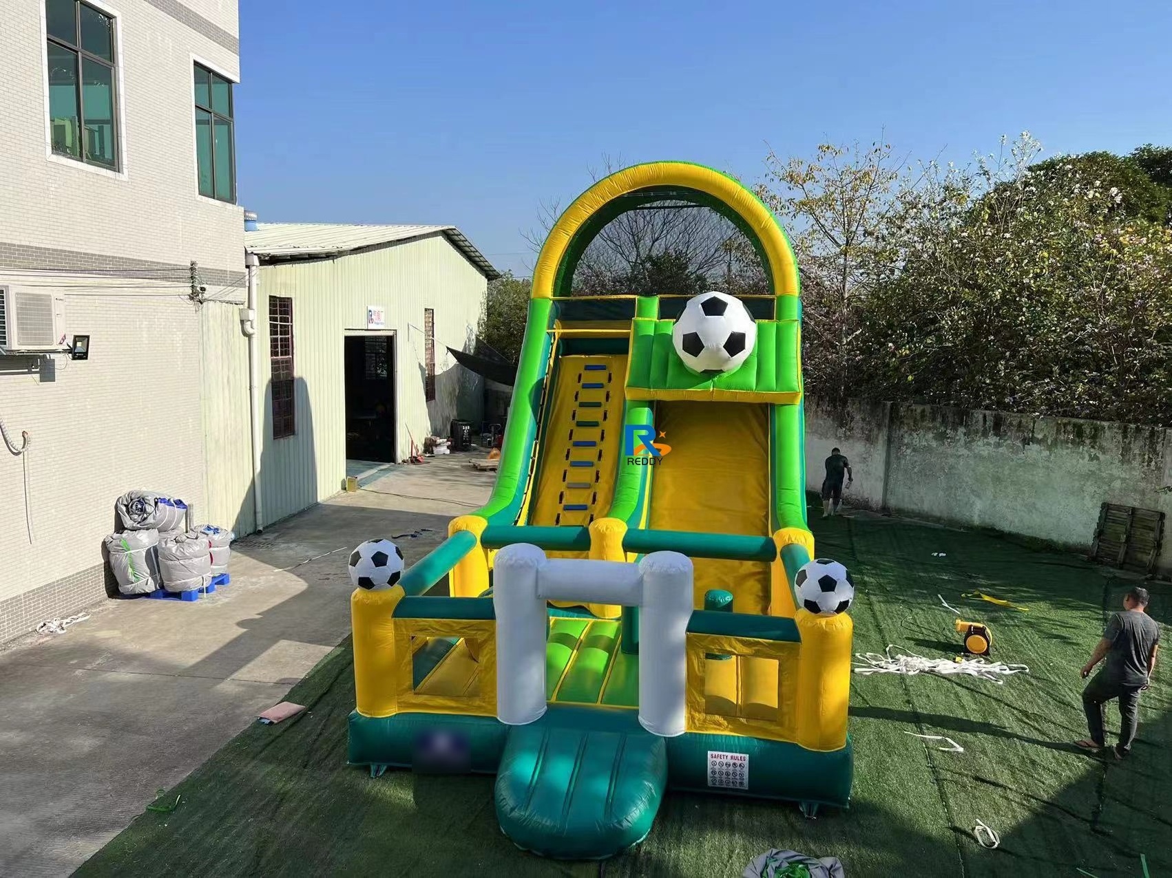 sports game bouncy castle commercial with obstacles and slide  inflatable soccer