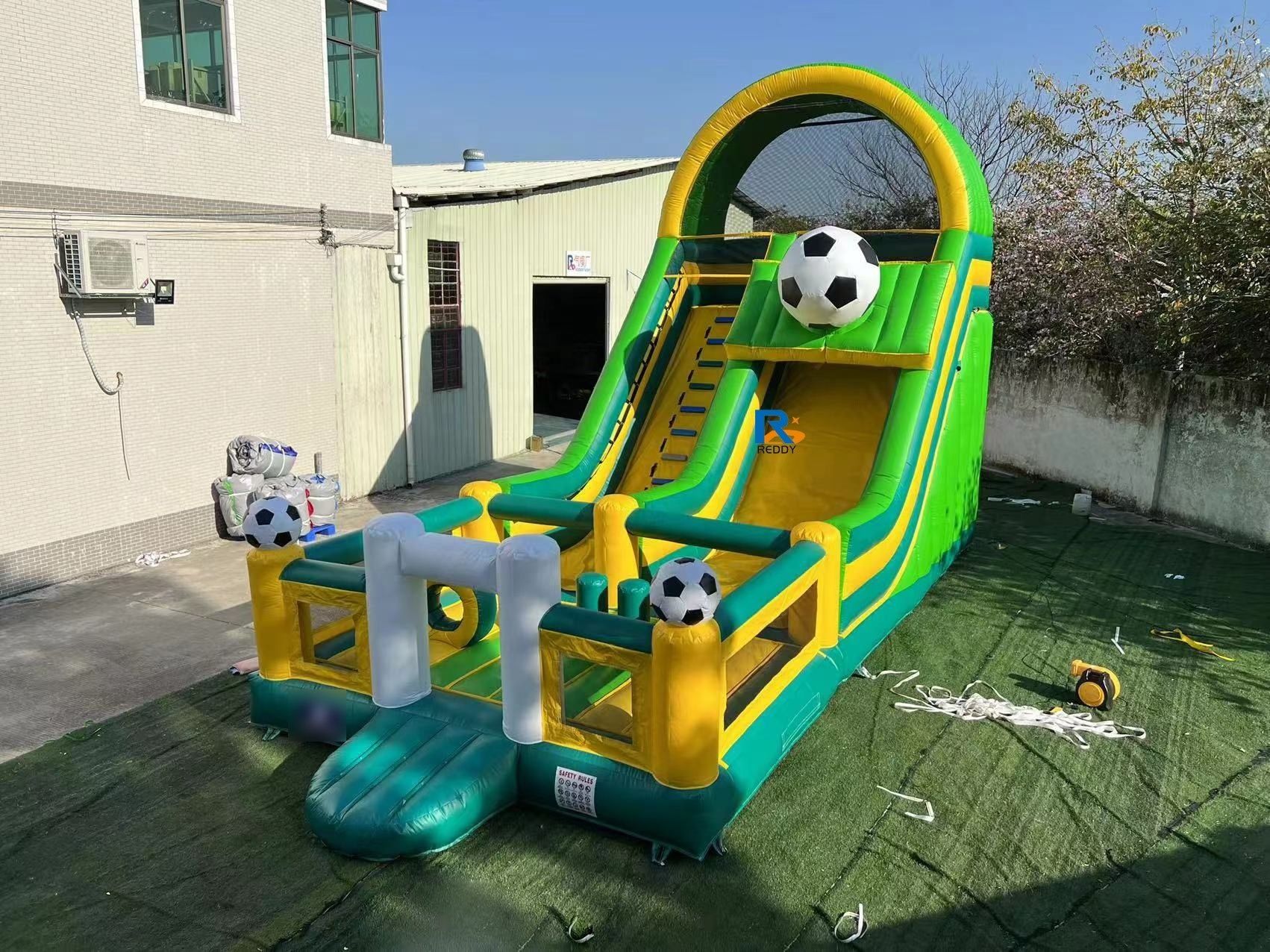 sports game bouncy castle commercial with obstacles and slide  inflatable soccer