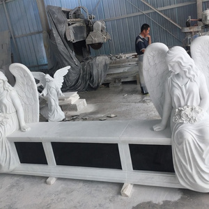 Marble double headstone with two sitting angel statues