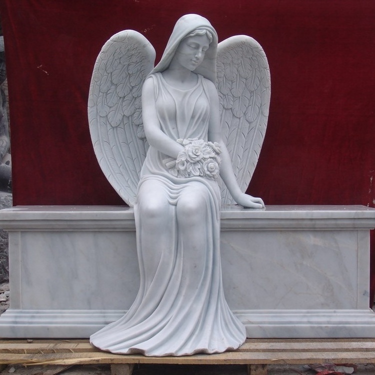 Marble double headstone with two sitting angel statues