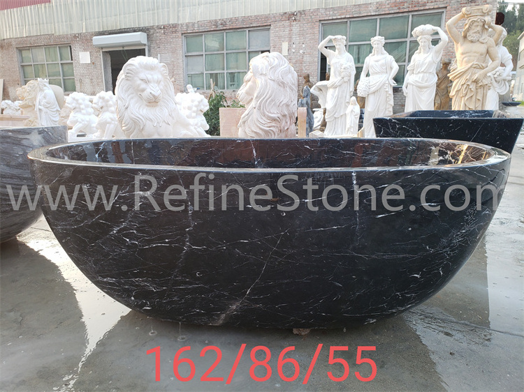 Polished black marble bathtub and hand carved stone bathtub