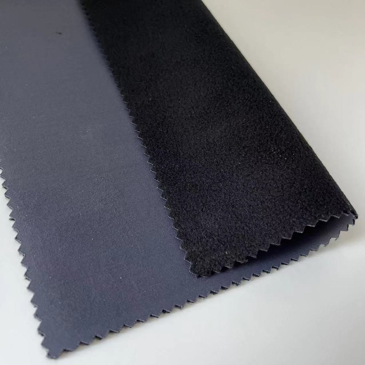 The Most Popular 3 Layer Softshell Terylene Ammonia Warp Knitting Fabric With TPU Bonded Polar Fleece Fabric