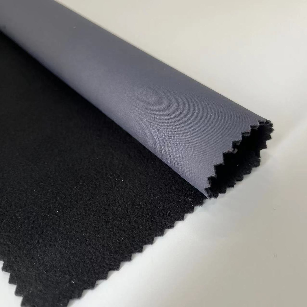 The Most Popular 3 Layer Softshell Terylene Ammonia Warp Knitting Fabric With TPU Bonded Polar Fleece Fabric