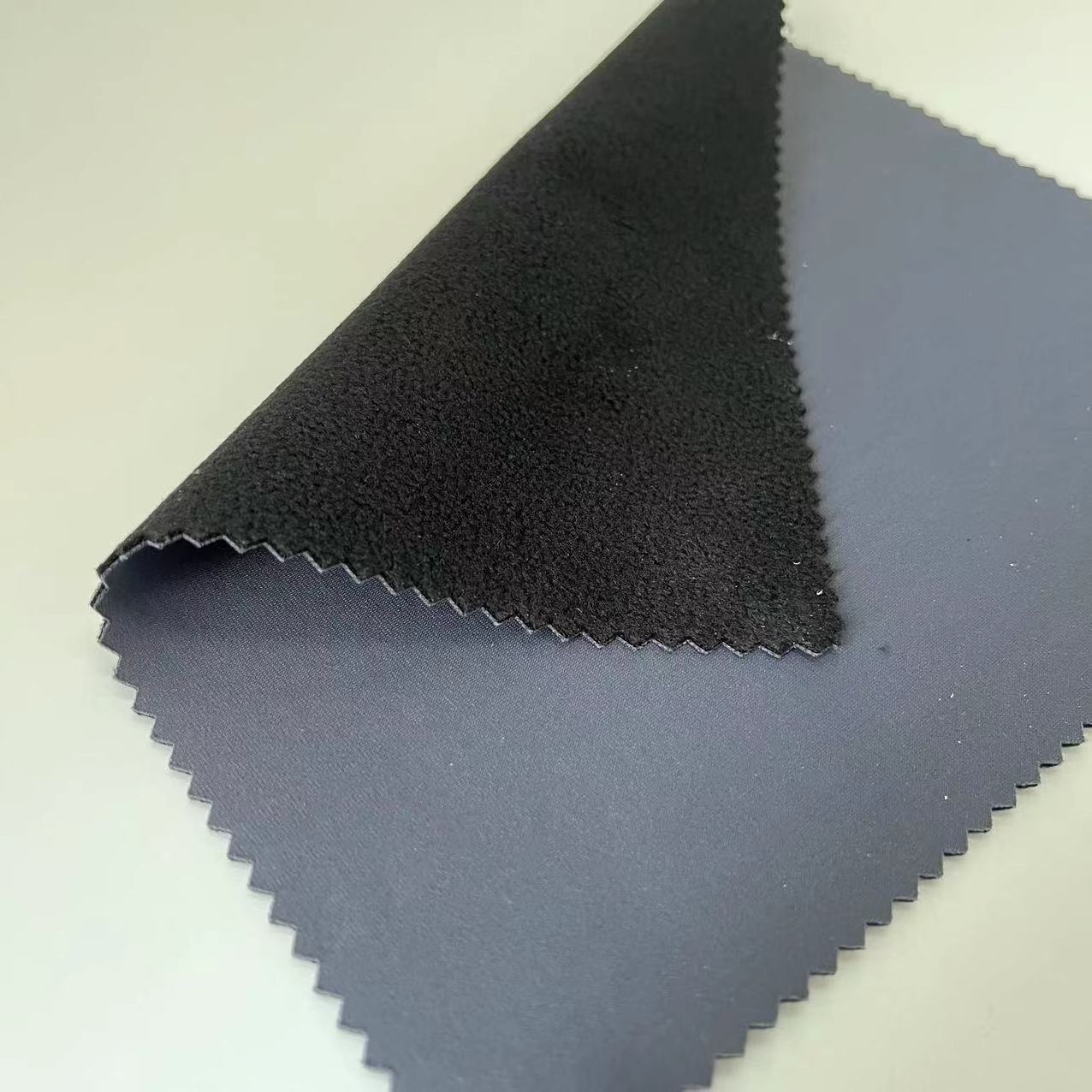 The Most Popular 3 Layer Softshell Terylene Ammonia Warp Knitting Fabric With TPU Bonded Polar Fleece Fabric