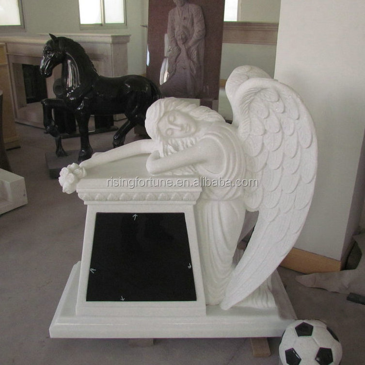 White marble headstone with angel engraving