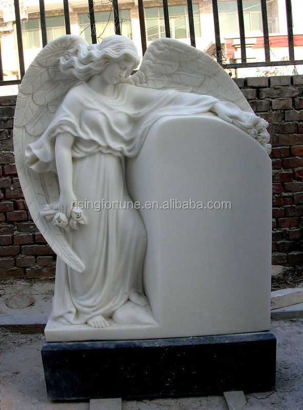 White marble headstone with angel engraving