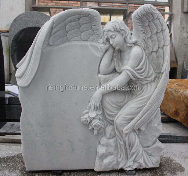 White marble headstone with angel engraving