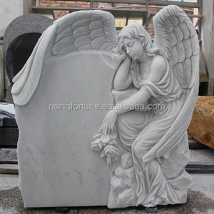 White marble headstone with angel engraving