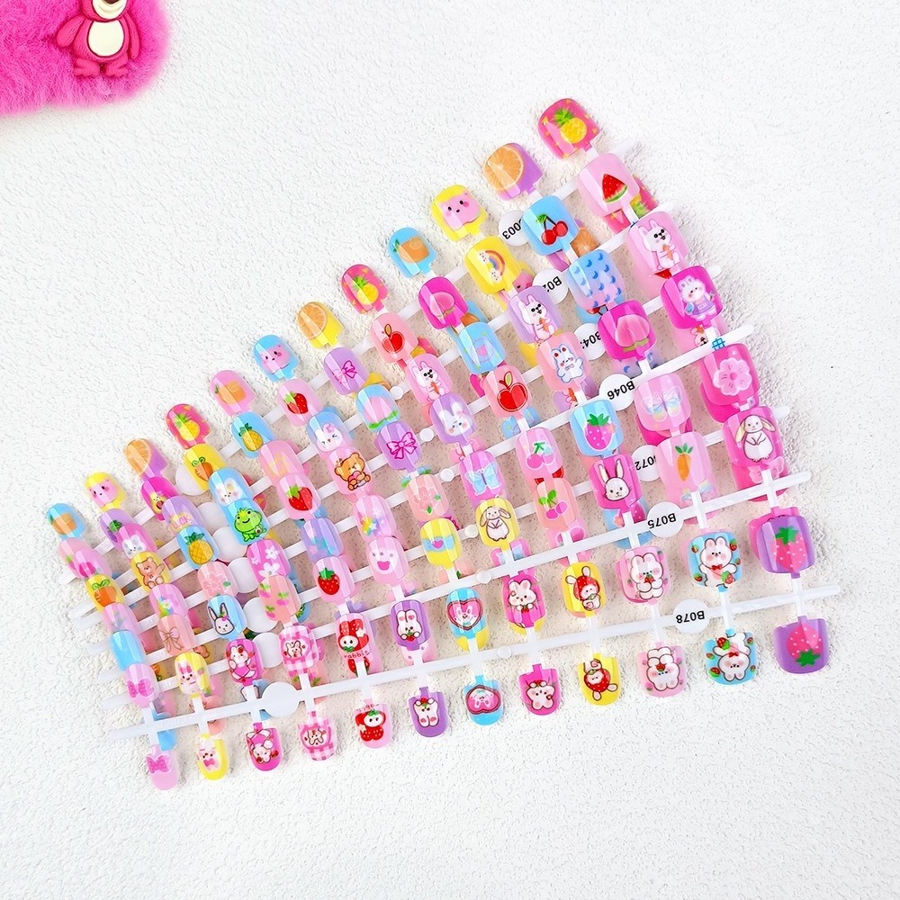 Wholesale nails for kids Colorful rainbow cute kids nail presses with glue nail artificial