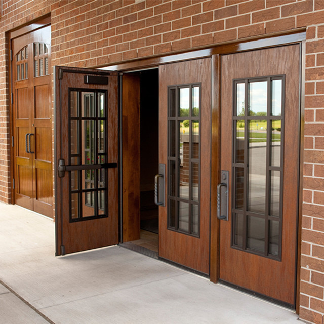 Restaurant entry solid hand and carved wooden door