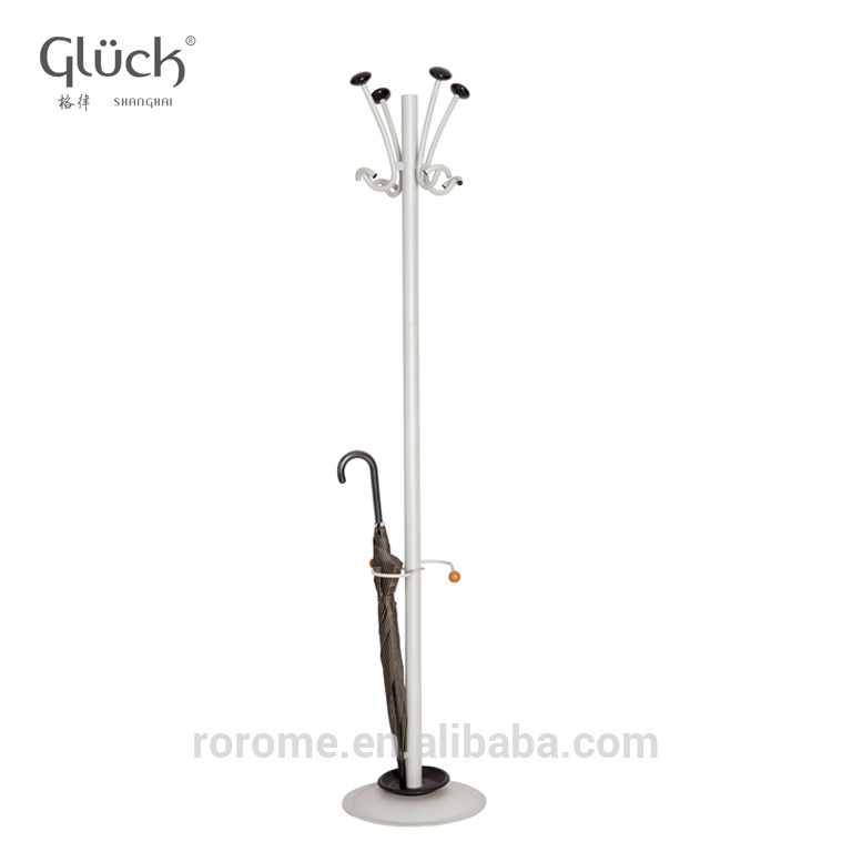 Standing tree-shaped coat rack display stand with umbrellas on the porch